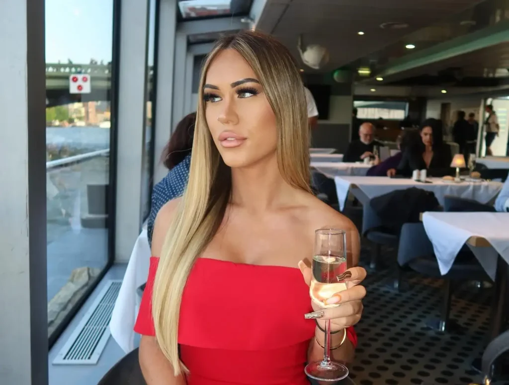 Adult star Kay Manuel posing for a photo.