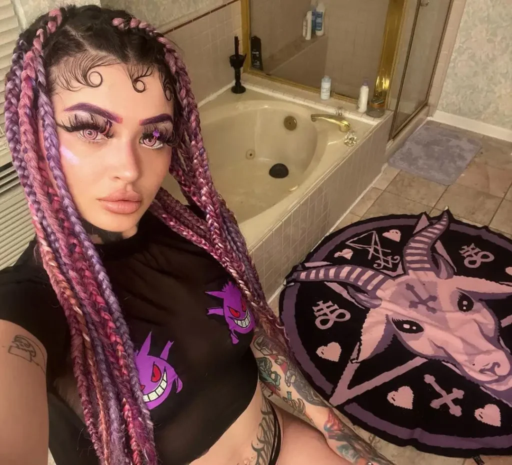 Peyton working as a mechanic posing for a photo