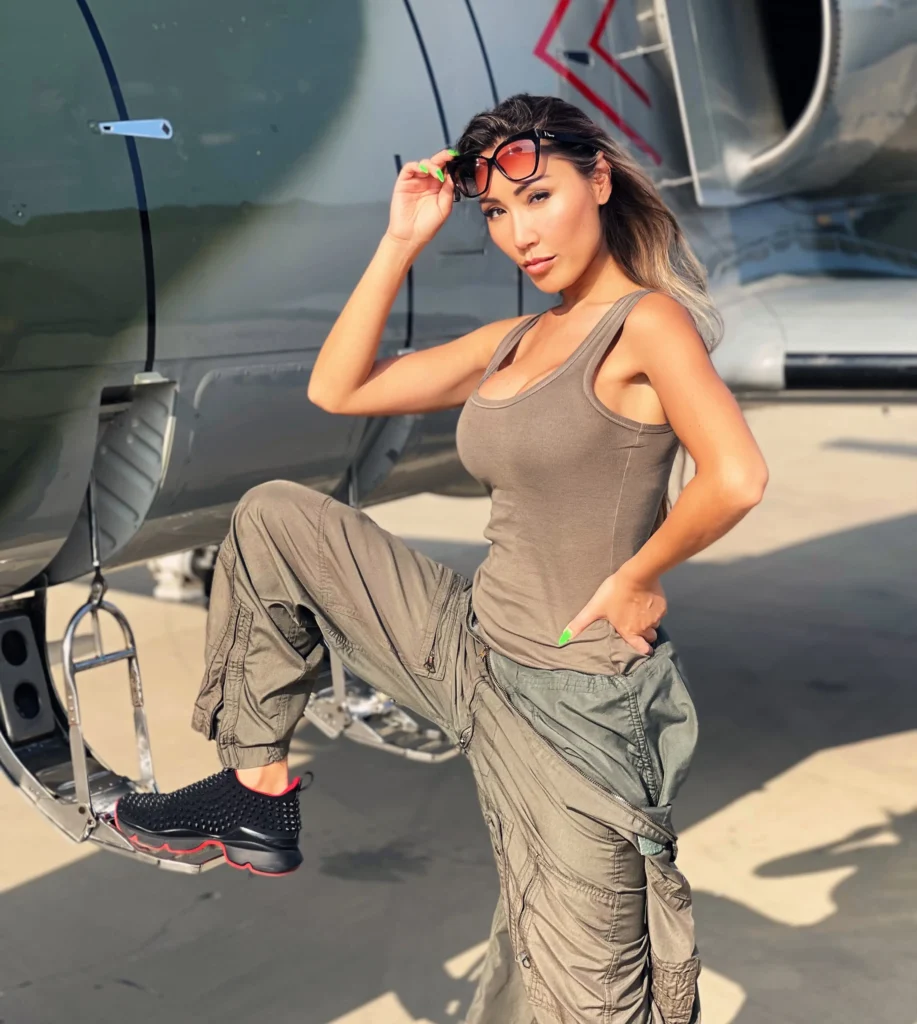 Aliia posing next to a L-39 Albatross jet.